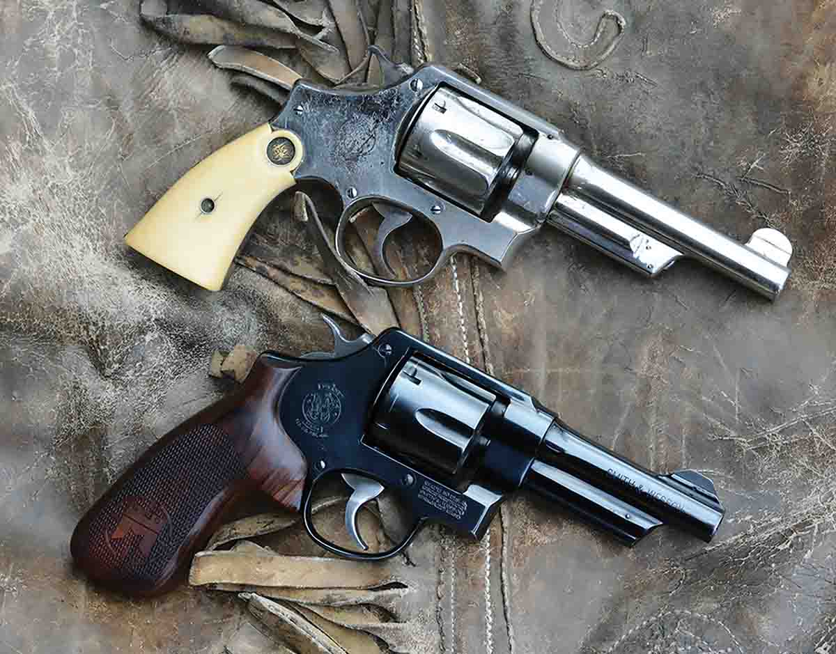 The Smith & Wesson Model 22-4 (bottom) with fixed sights and the virtues of a big bore, resembles the original 1908-era Smith & Wesson New Century 1st Model Hand Ejector – better known as the Triple Lock (top).